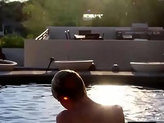 Blond twinky goes for a swim and then strokes his cock